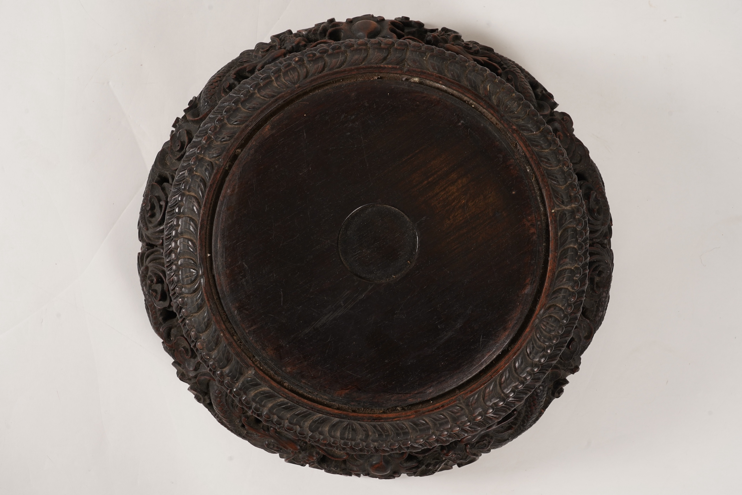 An impressive Chinese hongmu ‘dragon’ stand, late 19th century